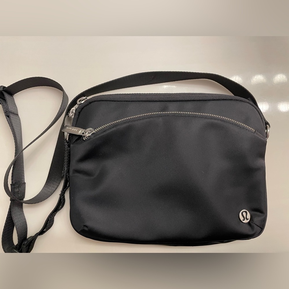 Black Lululemon City Adventurer crossbody bag.